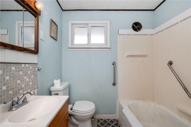 bathroom with toilet, shower / bath combination, vanity, baseboards, and ornamental molding