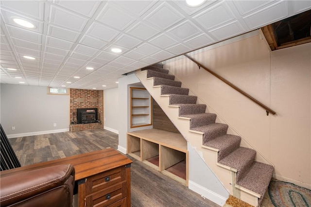 living area featuring stairs, baseboards, dark wood finished floors, and recessed lighting