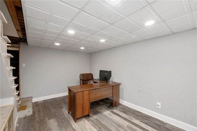 office featuring recessed lighting, baseboards, and wood finished floors