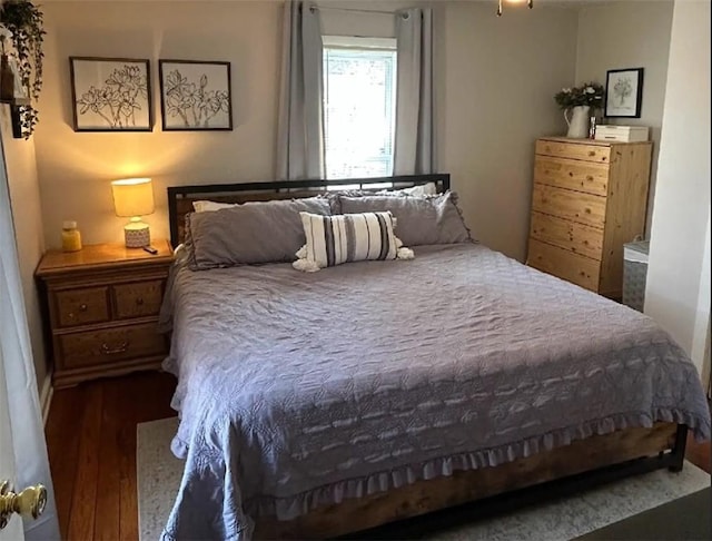 bedroom featuring wood finished floors