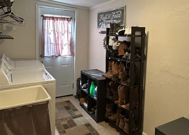 laundry room with washer and dryer, laundry area, and a sink