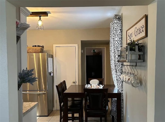 dining area with light tile patterned floors