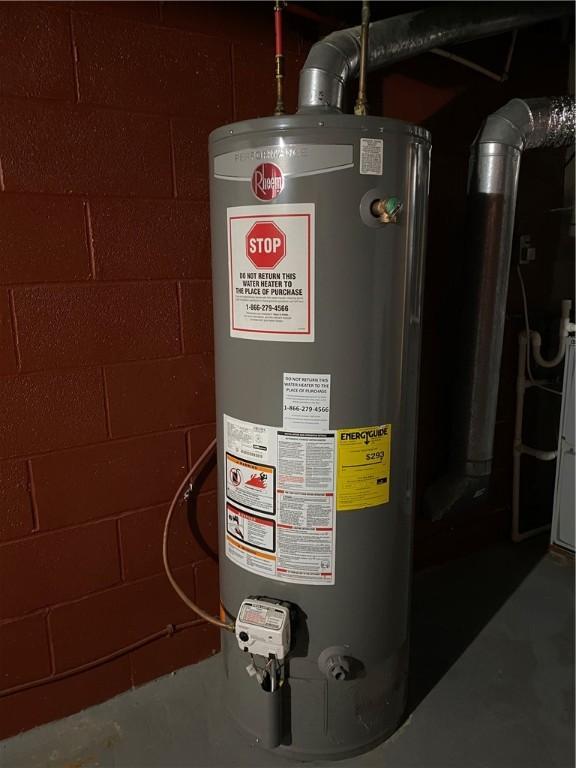 utility room featuring water heater