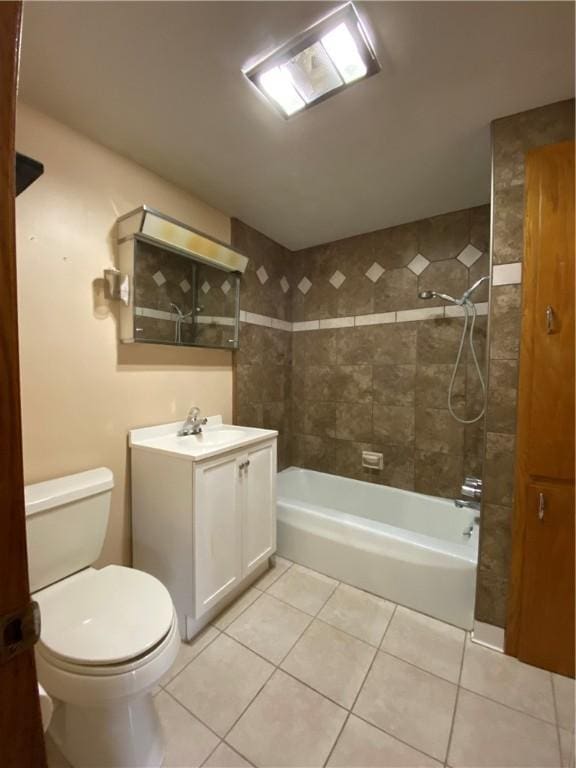 bathroom featuring toilet, vanity, shower / washtub combination, and tile patterned floors