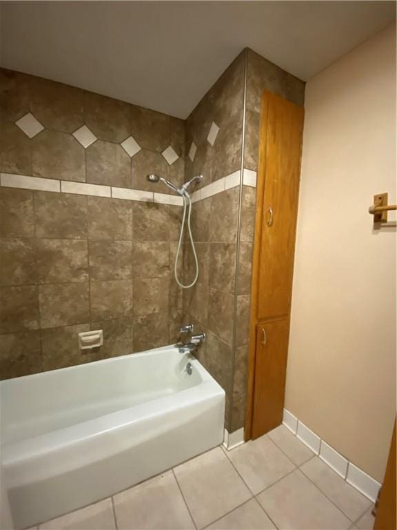 bathroom with  shower combination, baseboards, and tile patterned floors