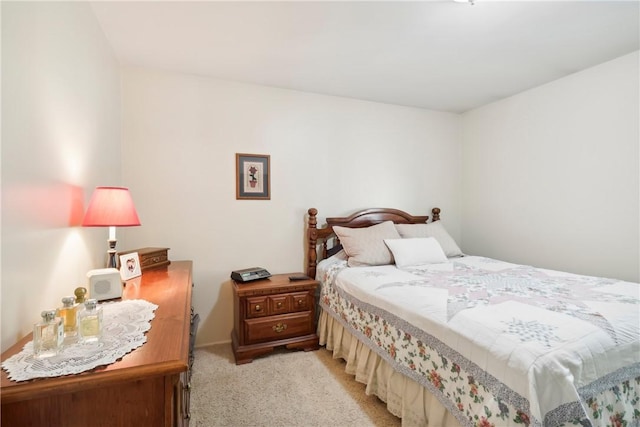 bedroom featuring light carpet