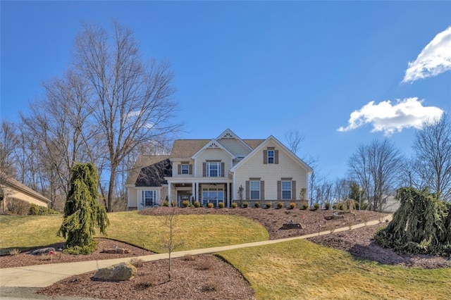 view of front of home featuring a front yard