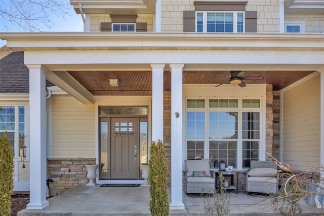 view of exterior entry with a shingled roof