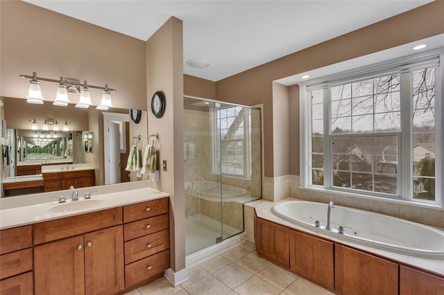 full bath featuring a tub with jets, tile patterned flooring, a shower stall, and a healthy amount of sunlight