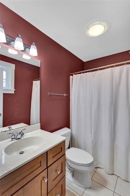 full bath with vanity, tile patterned flooring, and toilet