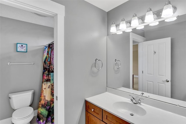 full bath featuring curtained shower, vanity, and toilet