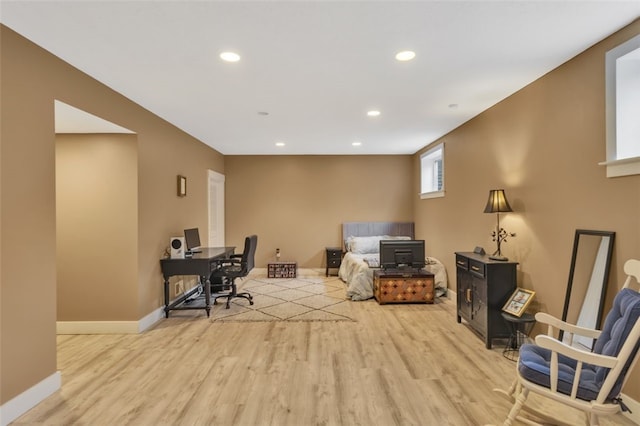 home office with light wood-type flooring, baseboards, and recessed lighting