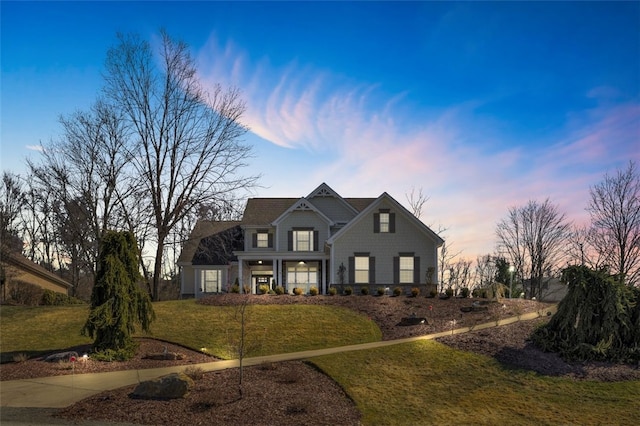 traditional home featuring a front yard