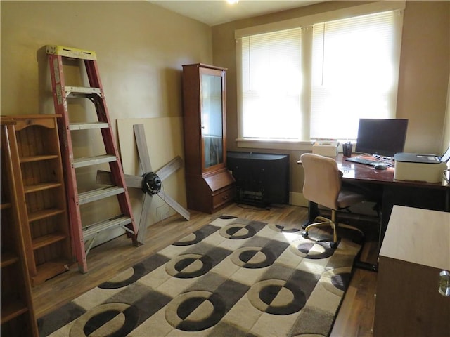 office space with wood finished floors