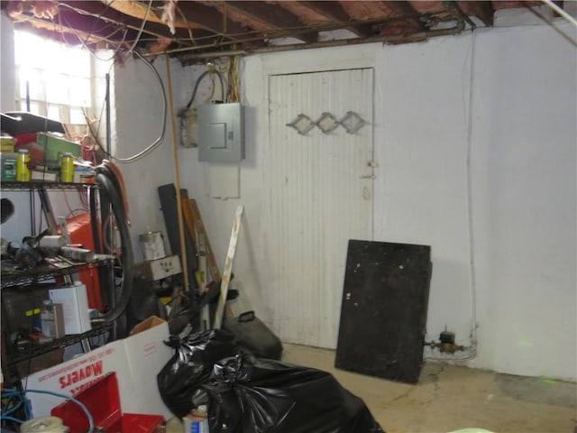 unfinished basement featuring electric panel