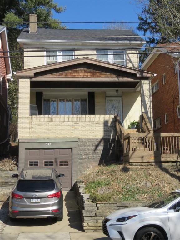 view of front of property with brick siding, driveway, and an attached garage