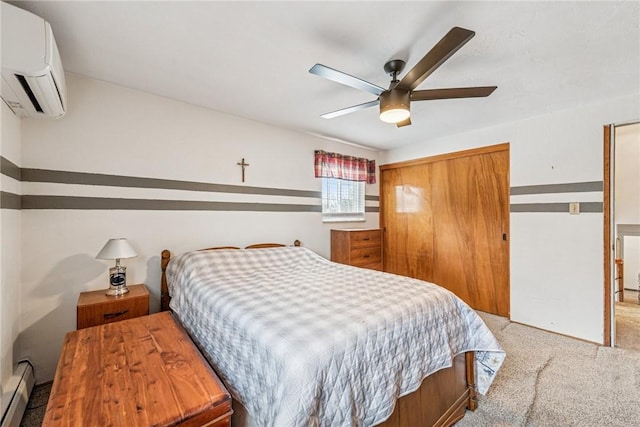 bedroom with carpet, a closet, a baseboard heating unit, ceiling fan, and a wall mounted air conditioner