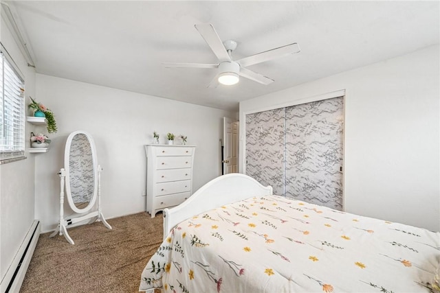 bedroom featuring a baseboard heating unit, carpet flooring, and a ceiling fan