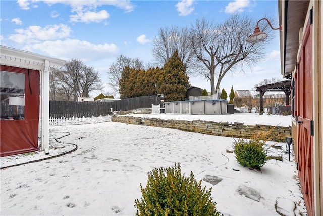 view of yard with a fenced backyard and a covered pool