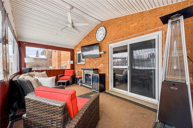 sunroom / solarium with lofted ceiling and ceiling fan