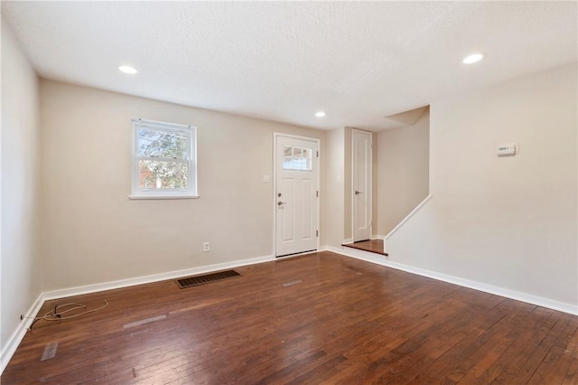 entrance foyer featuring recessed lighting, visible vents, baseboards, stairway, and wood-type flooring