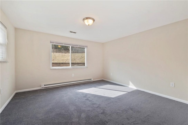 carpeted spare room with baseboard heating, visible vents, and baseboards