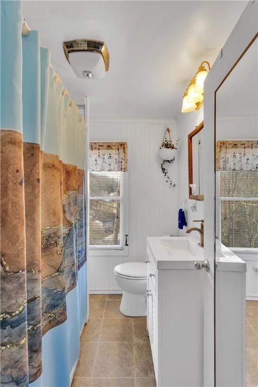 full bathroom with tile patterned flooring, a shower with curtain, vanity, and toilet