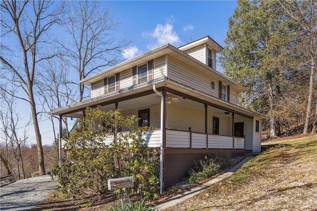 view of side of property featuring a porch