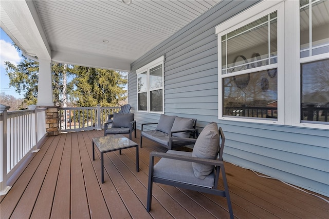 wooden deck featuring outdoor lounge area