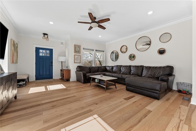 living area featuring light wood-style flooring, recessed lighting, baseboards, and ornamental molding