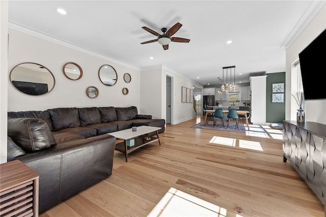 living room with recessed lighting, light wood-style flooring, crown molding, and ceiling fan