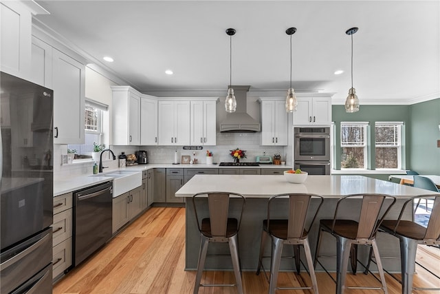 kitchen with crown molding, dishwasher, freestanding refrigerator, custom exhaust hood, and stainless steel double oven