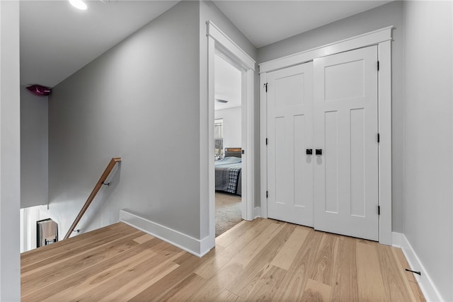 foyer with baseboards and wood finished floors