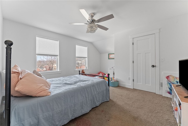 bedroom featuring carpet, ceiling fan, and vaulted ceiling