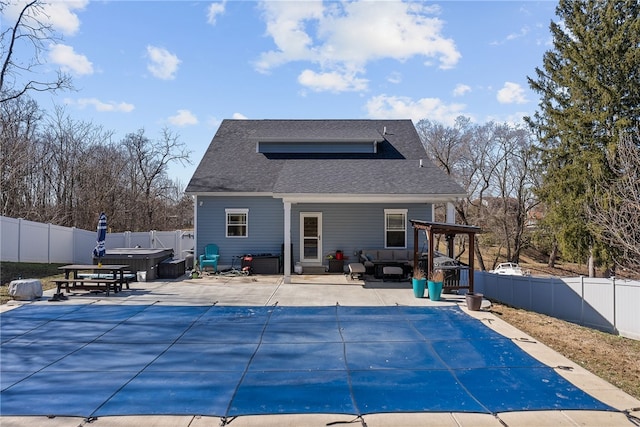 view of pool with a fenced backyard, a fenced in pool, a hot tub, and a patio