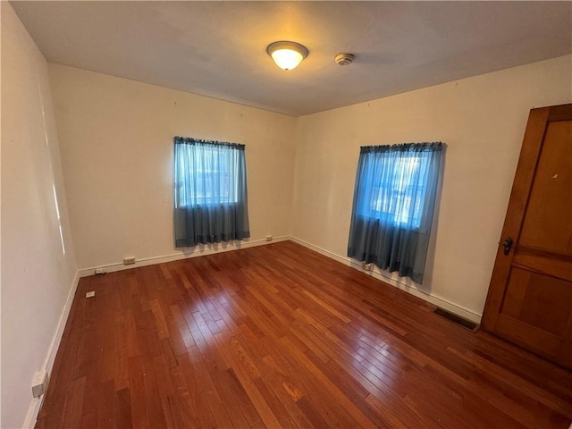 405 Washington St, Indiana Boro Ind, PA 15701 - unfurnished room with dark wood-style flooring, visible vents, and baseboards