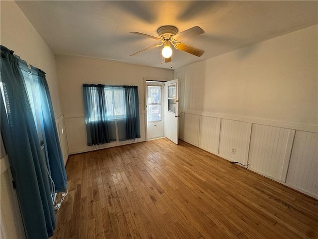 405 Washington St, Indiana Boro Ind, PA 15701 - unfurnished bedroom featuring wood-type flooring, a ceiling fan, and wainscoting