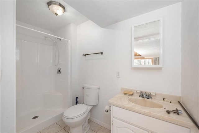 full bath with tile patterned flooring, toilet, vanity, baseboards, and walk in shower