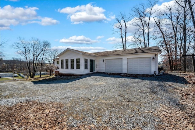 view of home's exterior featuring driveway and an attached garage