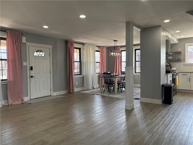 entrance foyer with recessed lighting, wood finished floors, and baseboards