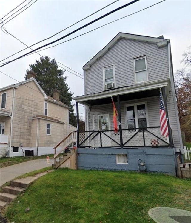 view of front of property with a front lawn and covered porch