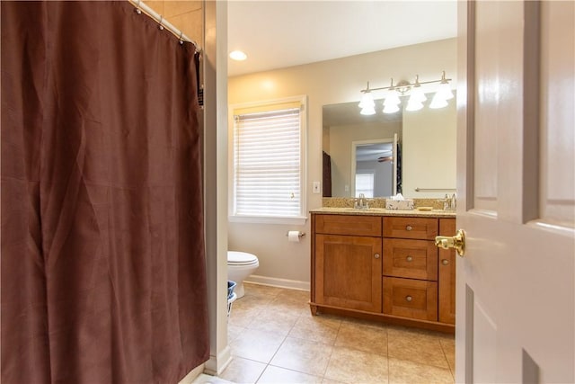 full bathroom with a shower with curtain, toilet, vanity, tile patterned flooring, and baseboards