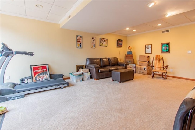 living room with carpet flooring, crown molding, and visible vents