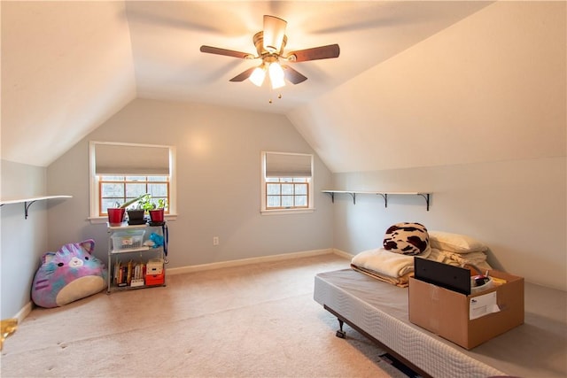 playroom with a healthy amount of sunlight, carpet floors, and lofted ceiling