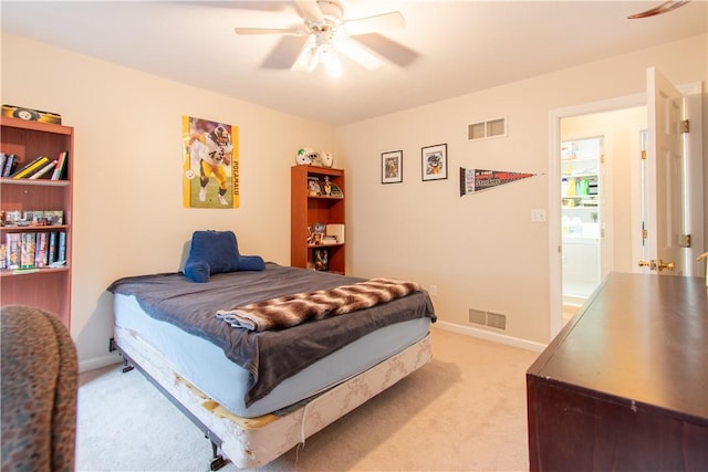 bedroom with light colored carpet, visible vents, ceiling fan, and baseboards