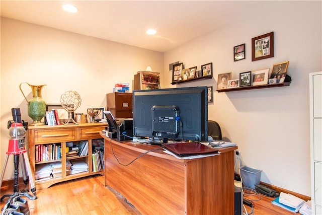 office featuring recessed lighting, baseboards, and wood finished floors