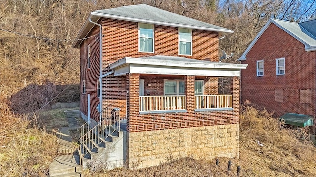 view of front of house with brick siding