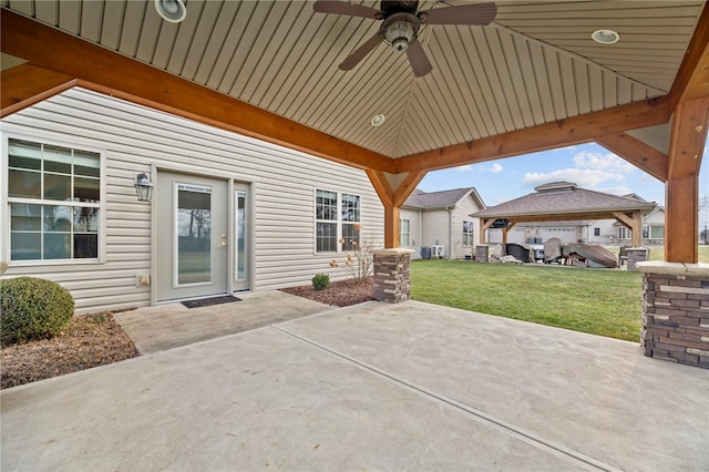 view of patio / terrace with ceiling fan and a gazebo