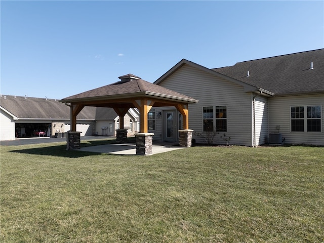 back of house with a yard, a patio area, cooling unit, and a gazebo