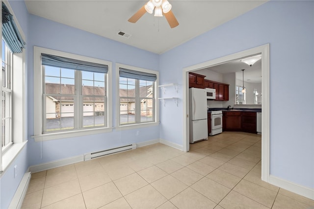 interior space featuring plenty of natural light, a baseboard radiator, visible vents, and a baseboard heating unit